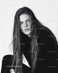 Black and White Portrait of Young Woman with Wet Hair and Intense Gaze