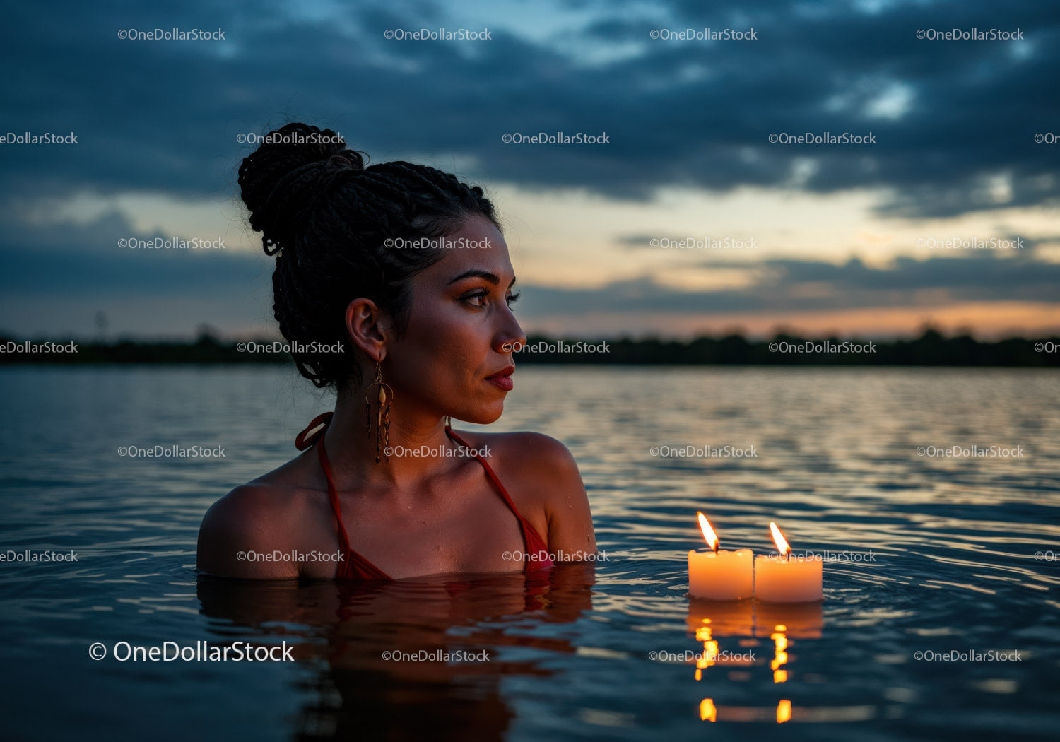 Woman in Black Bikini with Candles Floating in Lake at Sunset