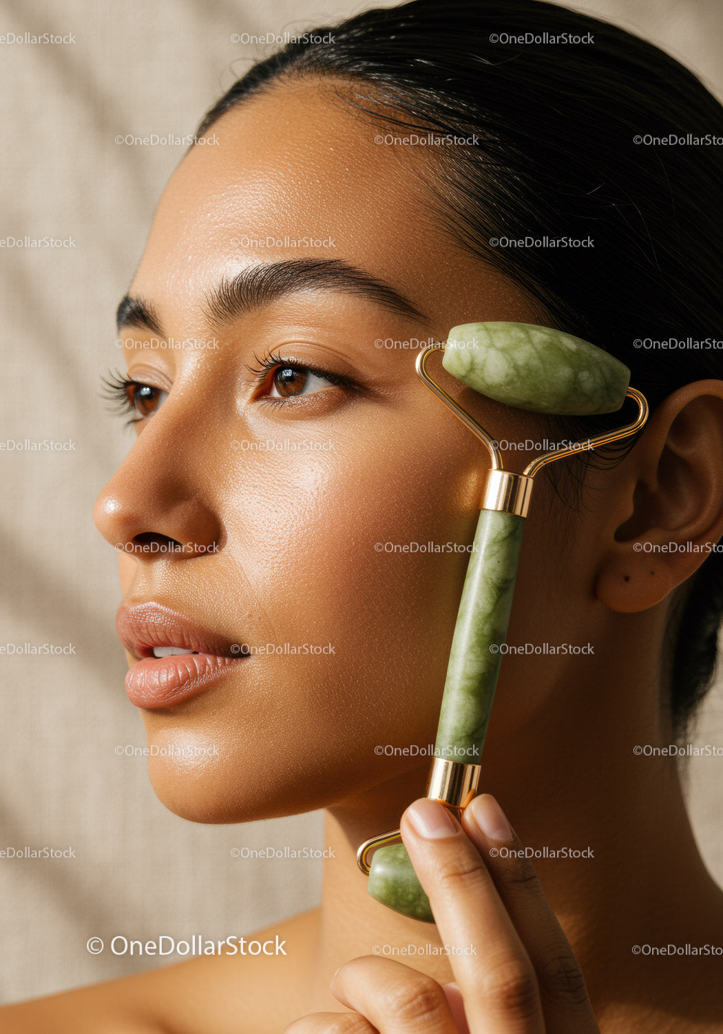 Young Woman Using Jade Roller for Facial Rejuvenation and Skin Care