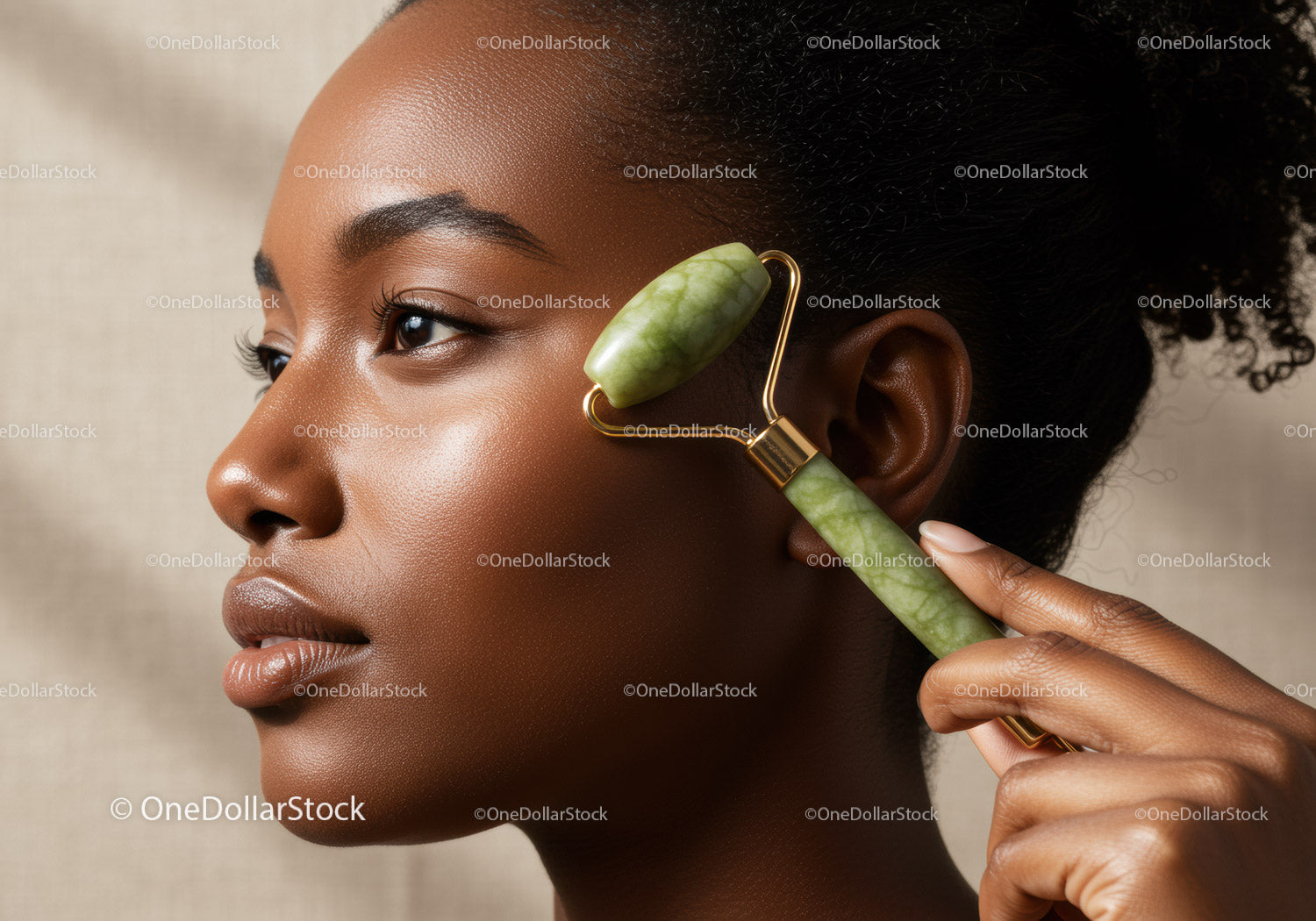 Black Woman Using Jade Roller for Facial Skincare and Relaxation