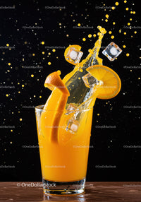 Refreshing orange juice splash with ice cubes and slice