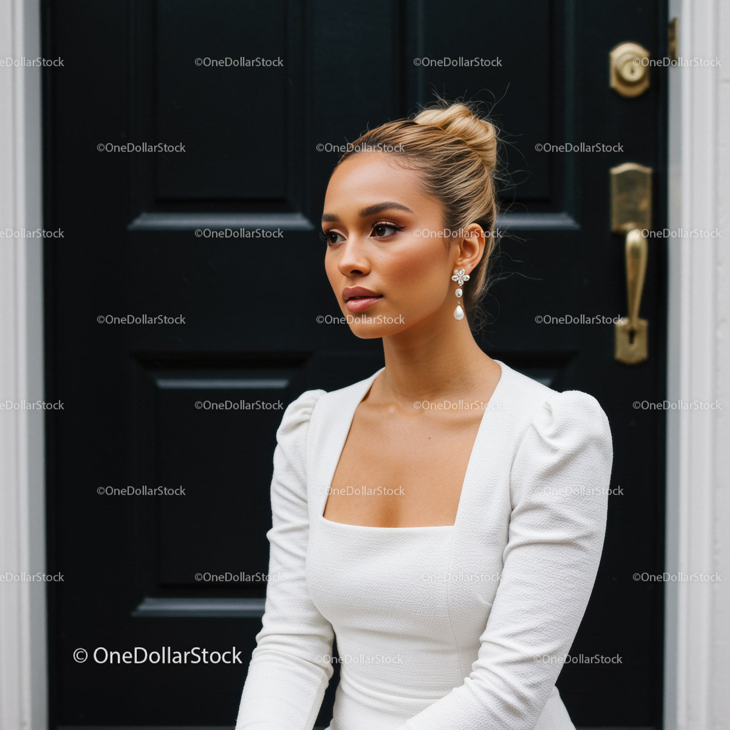 Elegant woman in white dress with pearl earrings