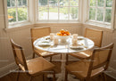 Cozy breakfast nook with natural sunlight and oranges