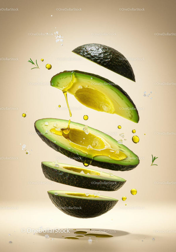 Sliced avocado with olive oil and sea salt drops