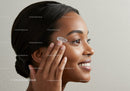 Young Woman Applying Skincare Cream for Healthy Glowing Skin