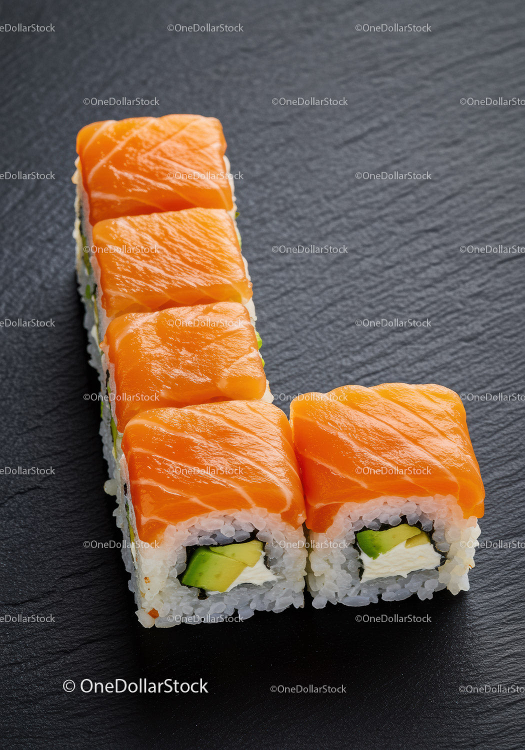 Fresh salmon sushi rolls with avocado and cream cheese