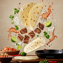 Floating taco ingredients with grilled meat and fresh salsa