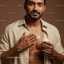 Handsome Man Applying Body Lotion for Smooth Skin and Moisturization