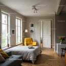 Bright and Cozy Bedroom with Yellow Armchair and Wooden Flooring