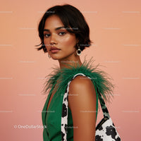 Stylish Woman with Feathered Green Dress and Cow Print Accessories
