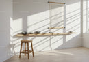 Minimalist room with wooden stool and zen stones shelf