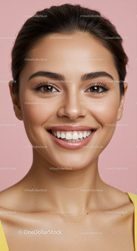 Close up of happy woman smiling against pink background