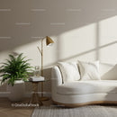 Cozy modern living room corner with white sofa and greenery
