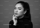 Elegant Black and White Portrait of a Confident Woman with Hoop Earrings