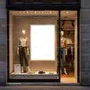 Minimalist fashion store window with casual outfits