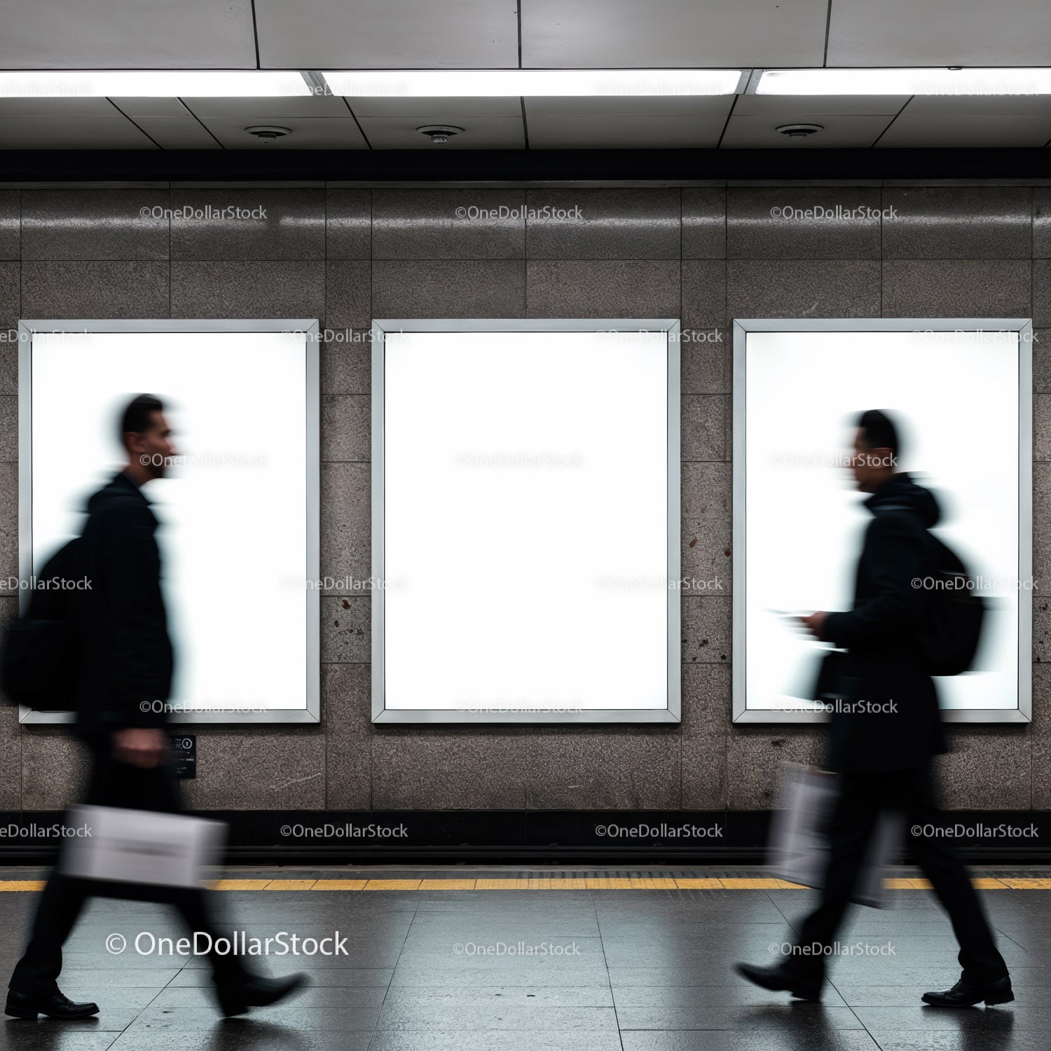 Blurred commuters walking past empty subway ads