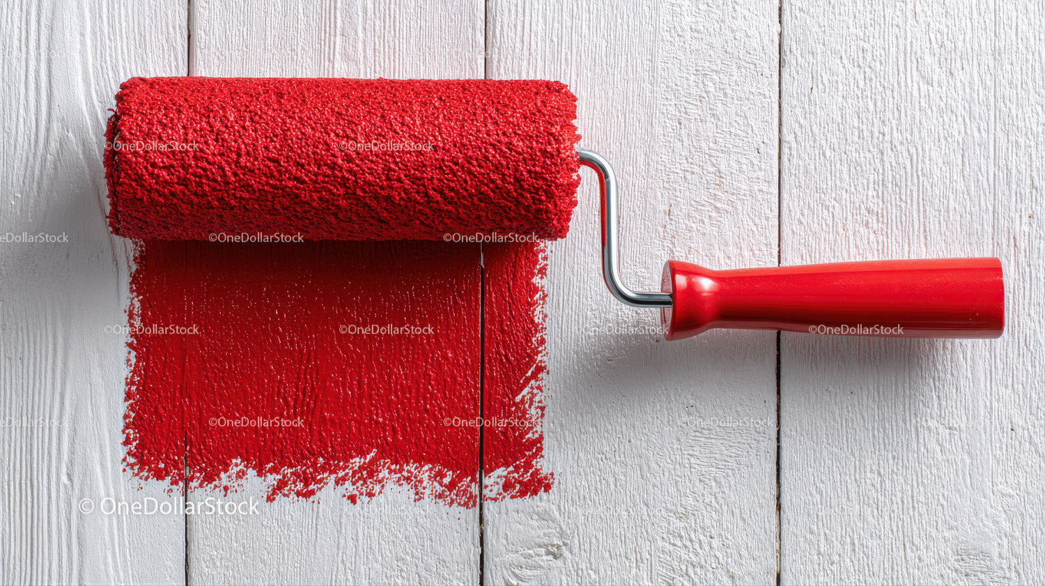 Red Paint Roller Applying Bright Red Color to Interior Wall