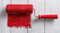 Red Paint Roller Applying Bright Red Color to Interior Wall