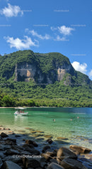 Tropical Mountain Cliffside with Clear Water and Boat Scene
