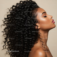 Profile of elegant woman with voluminous curly hair
