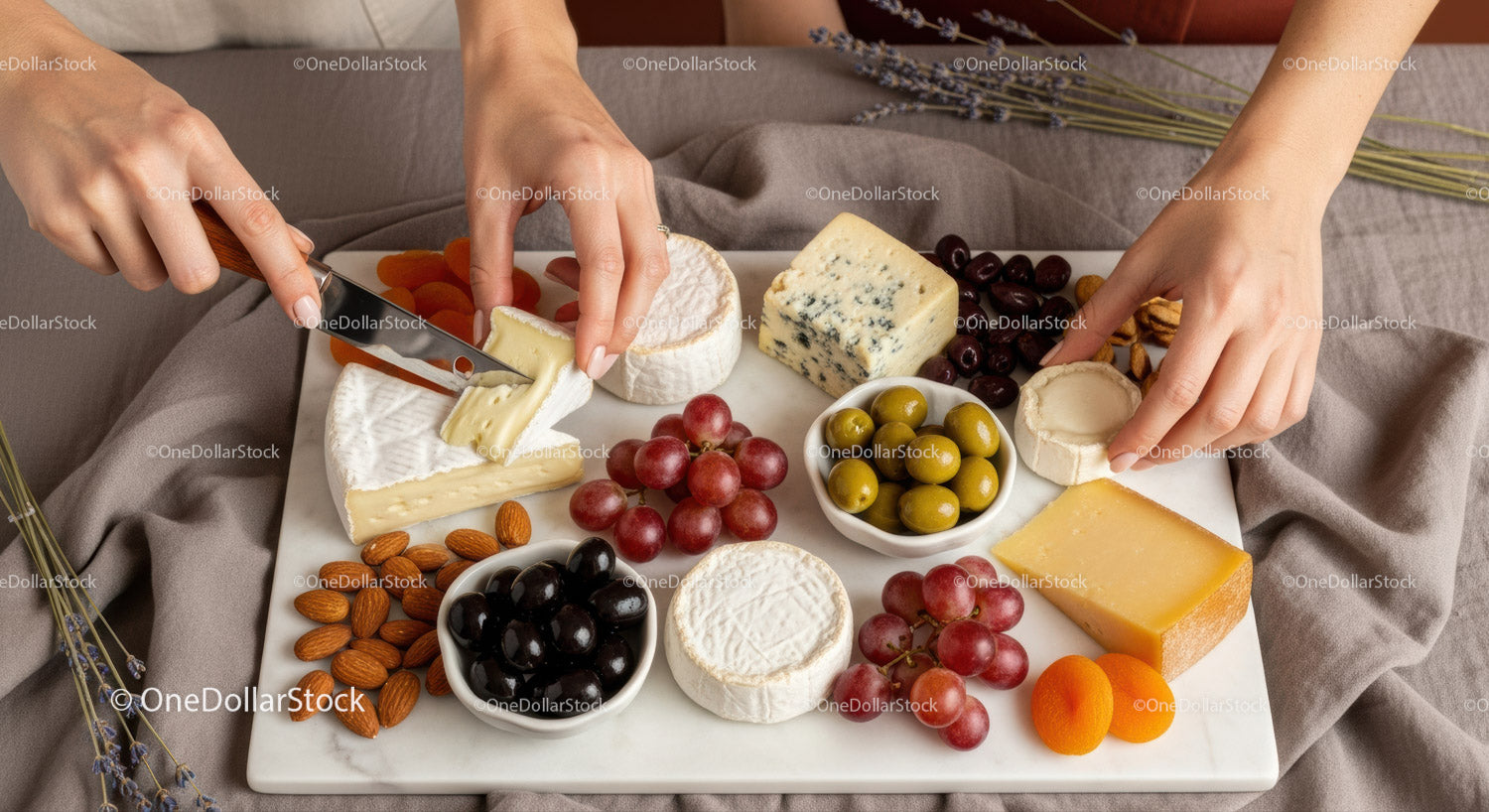 Gourmet Cheese Platter with Grapes and Assorted Dried Fruits