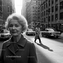 Elegant Mature Woman in Vintage City Scene with Classic Cars