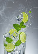 Fresh lime and mint splash with ice cubes in glass