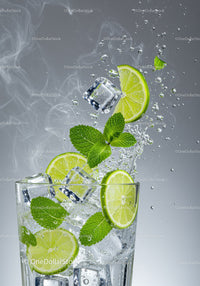 Fresh lime and mint splash with ice cubes in glass