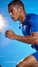 Focused young athlete sprinting with intensity and sweat