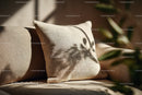 Beige Linen Cushion on Soft Sofa with Natural Lighting