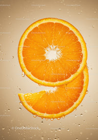 Fresh orange slices dripping with water droplets