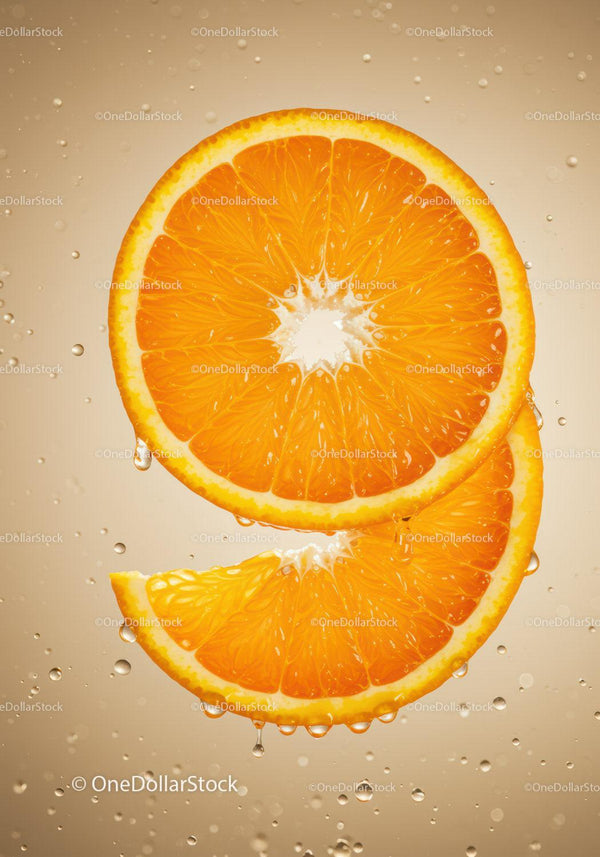 Fresh orange slices dripping with water droplets