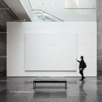 Woman Observing Large White Canvas in Modern Gallery