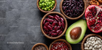 Assorted Beans and Fruits in Wooden Bowls with Vibrant Colors