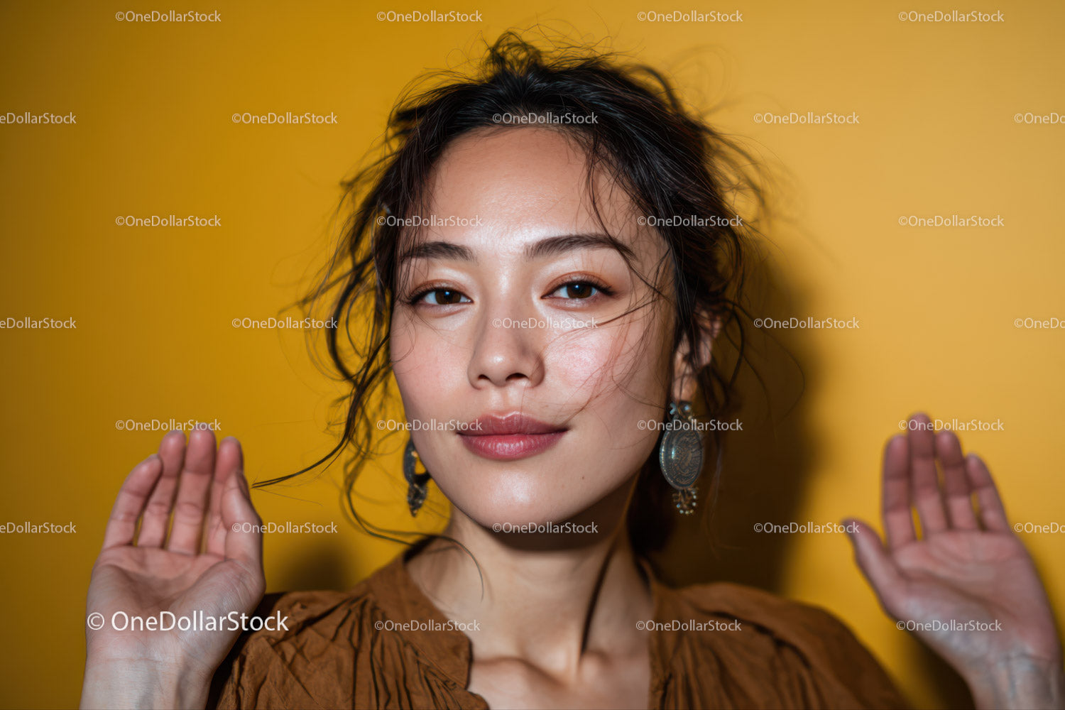 Elegant Young Woman with Curly Hair and Earrings on Yellow Background