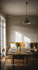 Cozy dining area with sunlight and fresh flowers