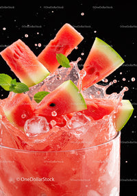 Refreshing watermelon pieces splashing in cold drink