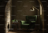 Cozy reading nook with green armchair and warm lighting