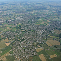 Aerial View of Suburban Cityscape with Green Spaces and Road Network