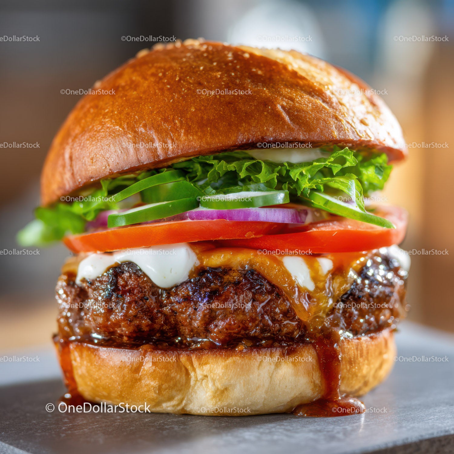 Juicy Gourmet Cheeseburger with Fresh Vegetables and Melted Cheese