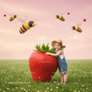 Child hugging oversized strawberry in flowering meadow