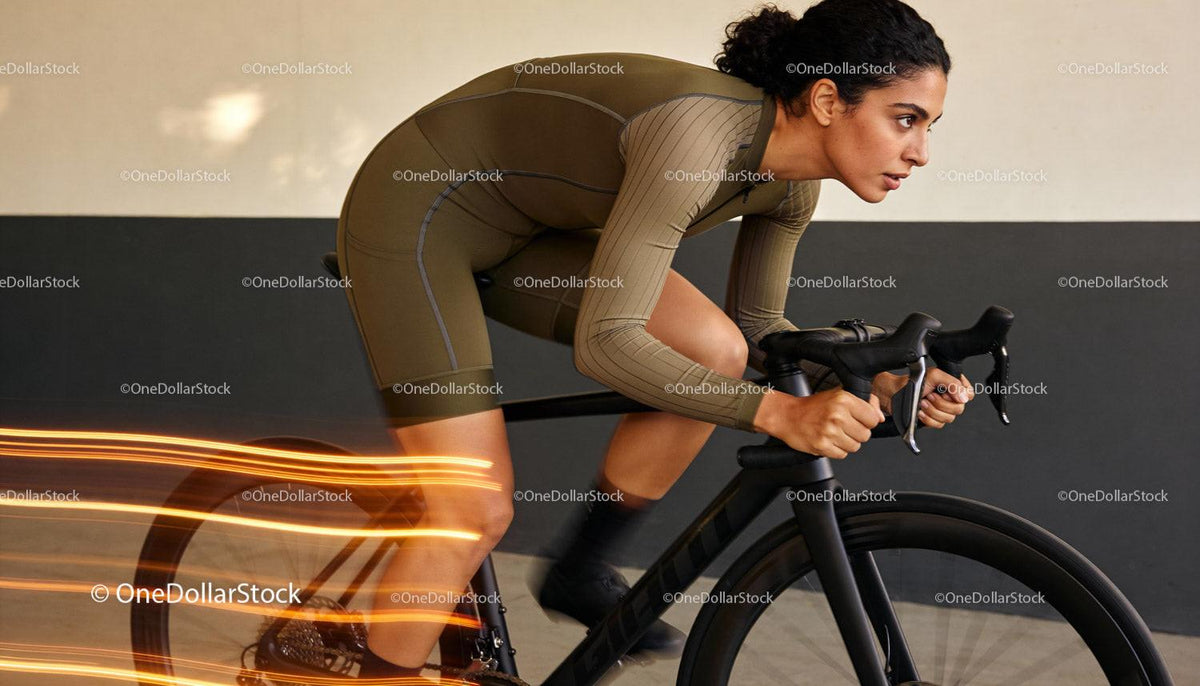 Focused Woman Cycling Intense Indoor Training Session