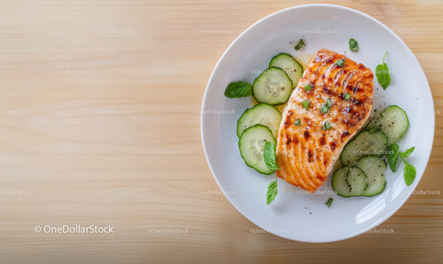 Grilled Salmon with Cucumber and Basil on White Plate