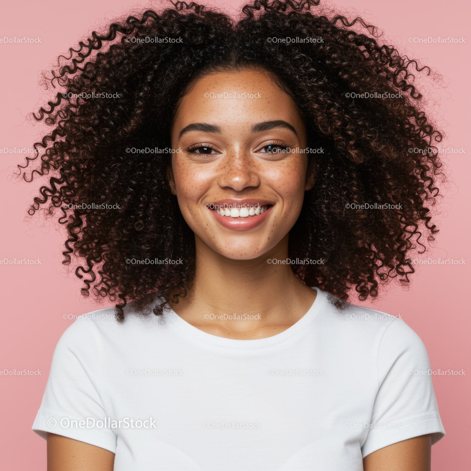 Young Woman with Curly Hair Smiling Against Pink Background