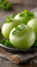 Fresh Green Onions with Mint Garnish on Rustic Plate