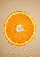 Fresh orange slice with water droplets in soft light