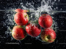 Fresh Red Apples Splashing into Water in Vibrant Motion