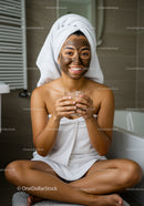 Woman Relaxing with Facial Mask and Towel in Bathroom Setting