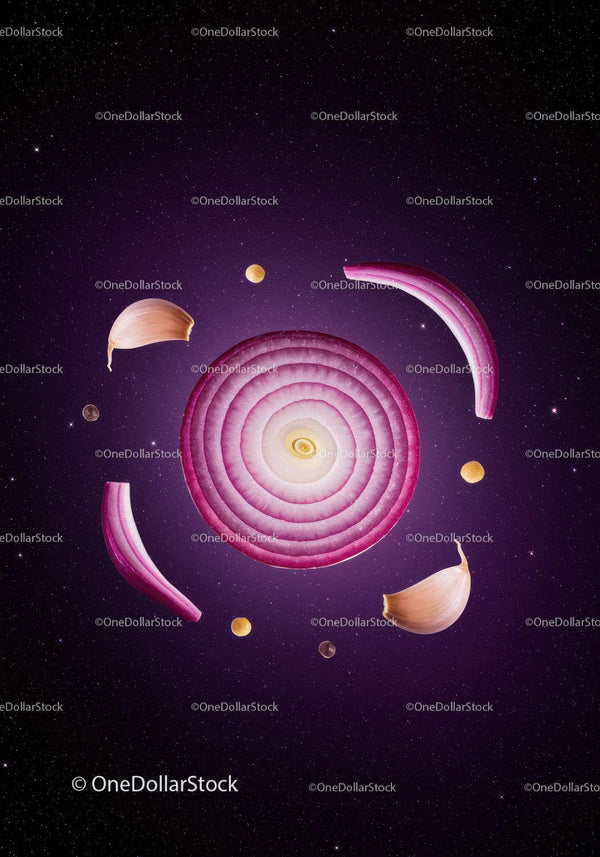 Sliced red onion and garlic arranged like a galaxy