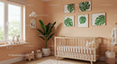 Modern Nursery Room with Green Tropical Wall Art and Wooden Baby Crib